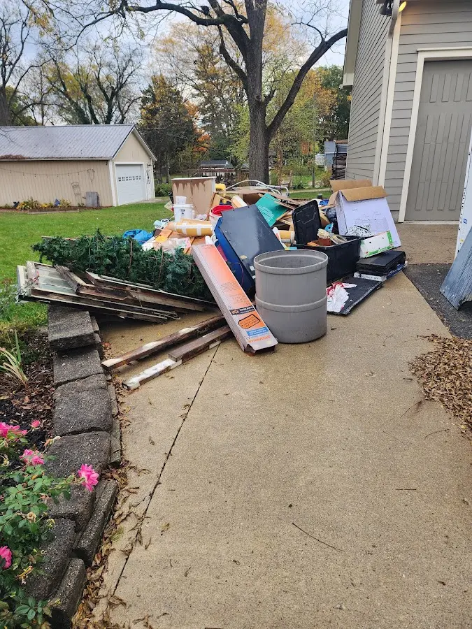 Dumpster being loaded with debris for 3 Yard Dumpster Rental in Shady Shores